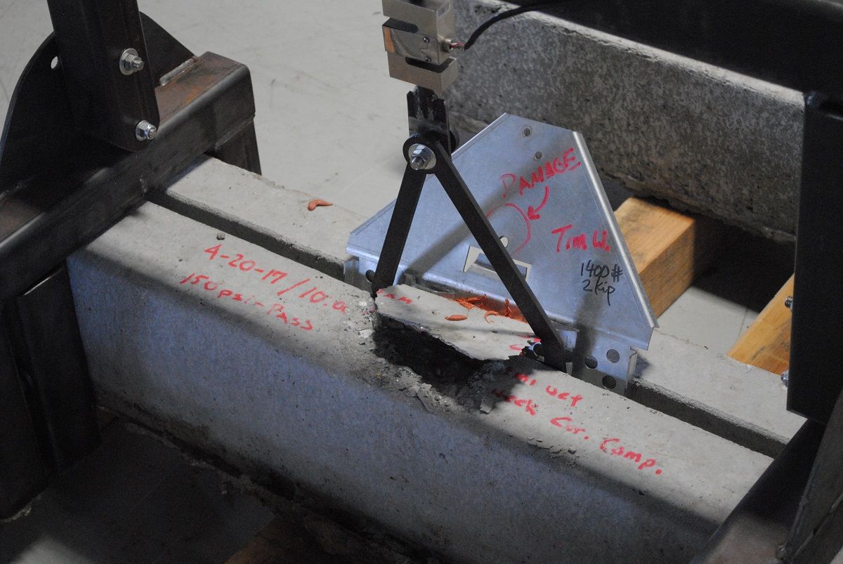 Glue strength test on concrete rail with steel frame